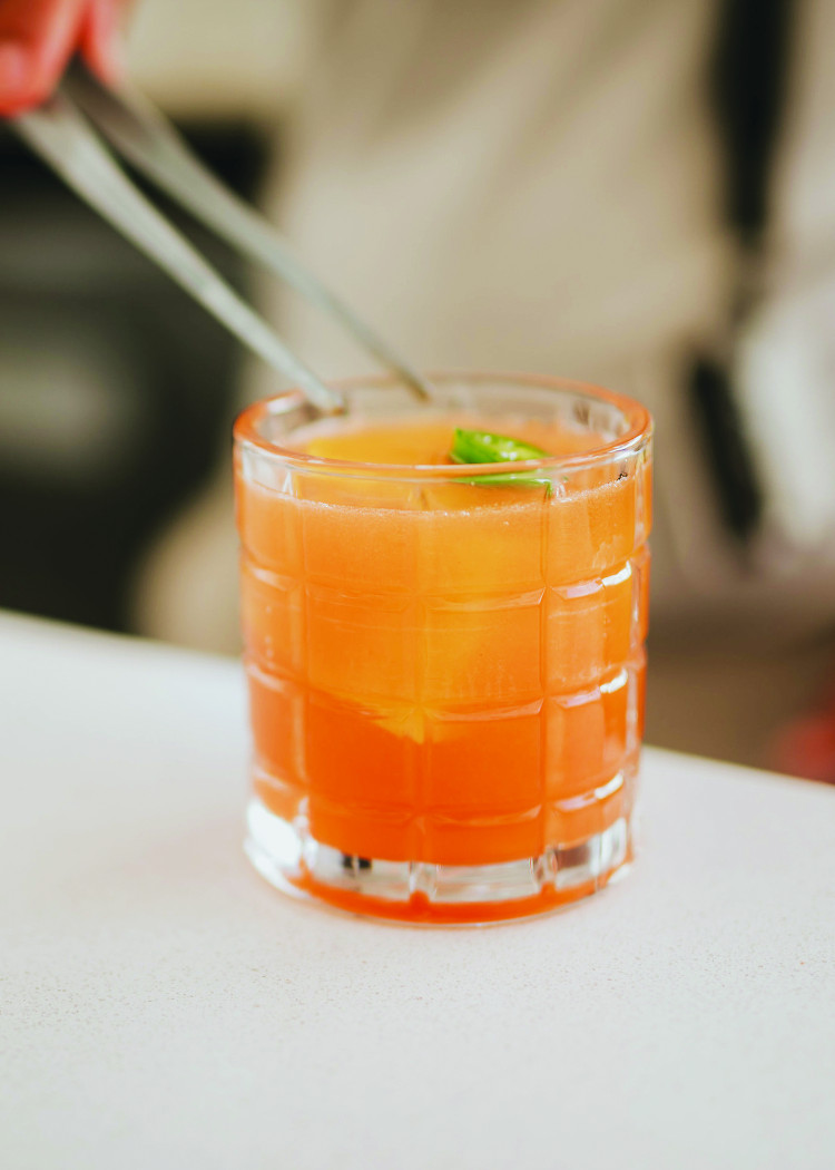 Peligroso Old Fashioned—Homemade sweet red bell pepper syrup, yellow Madame Jeanette pepper, salsa, bourbon